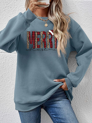 Misty Blue sweatshirt with "Merry Christmas" graphic in buffalo plaid and leopard print.