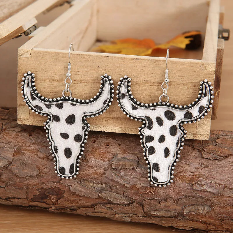 Cow print bull head drop earrings with silver trim and beaded edge