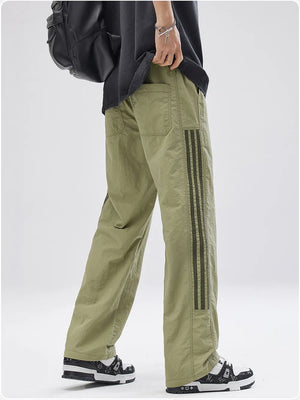 Men's sage green casual drawstring sweatpants with triple stripe detail on the leg