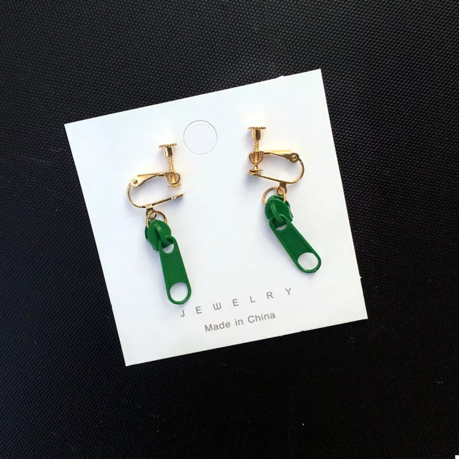 Dark green zipper dangle clip-on earrings with gold-tone hardware.