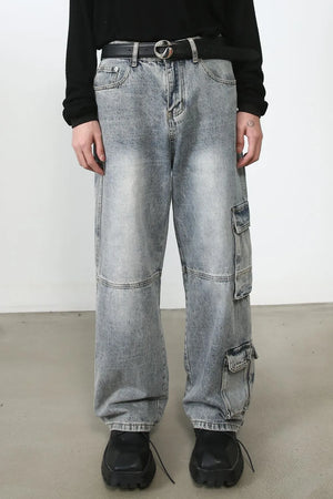 Baggy distressed medium wash denim cargo pants with multiple pockets.