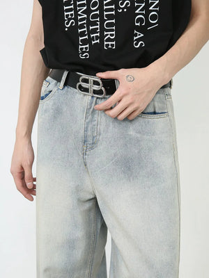 Faded denim palazzo pants in light wash with relaxed, oversized fit.