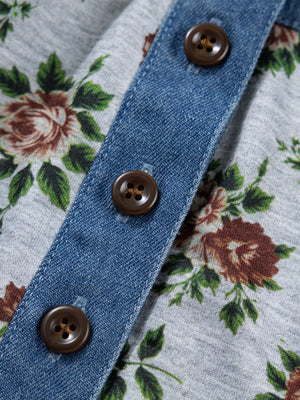 Denim patchwork floral blouse with button front and brown buttons.