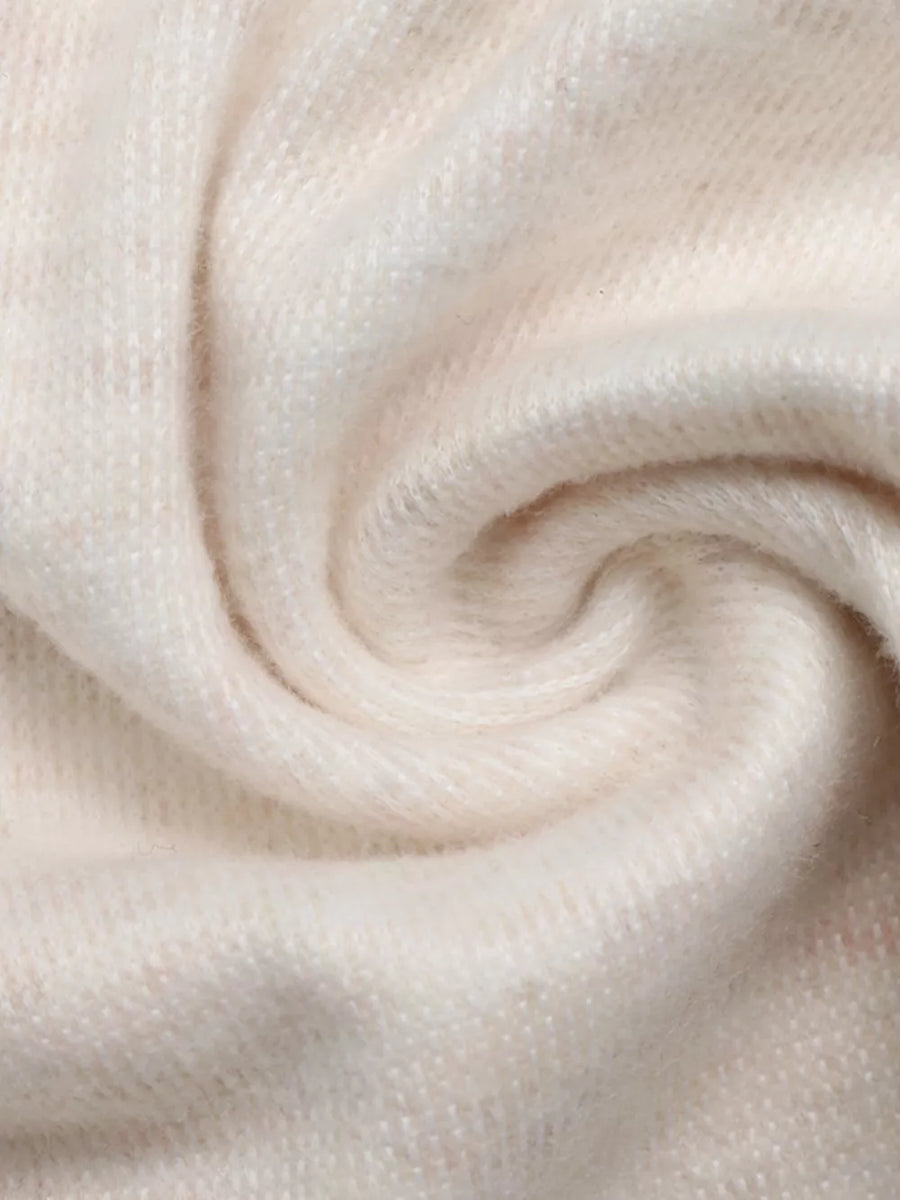 Cream knit fabric with a soft texture and subtle sheen.