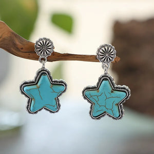 Southwestern starburst drop earrings in sky blue with cracked detail and silver-tone alloy setting.