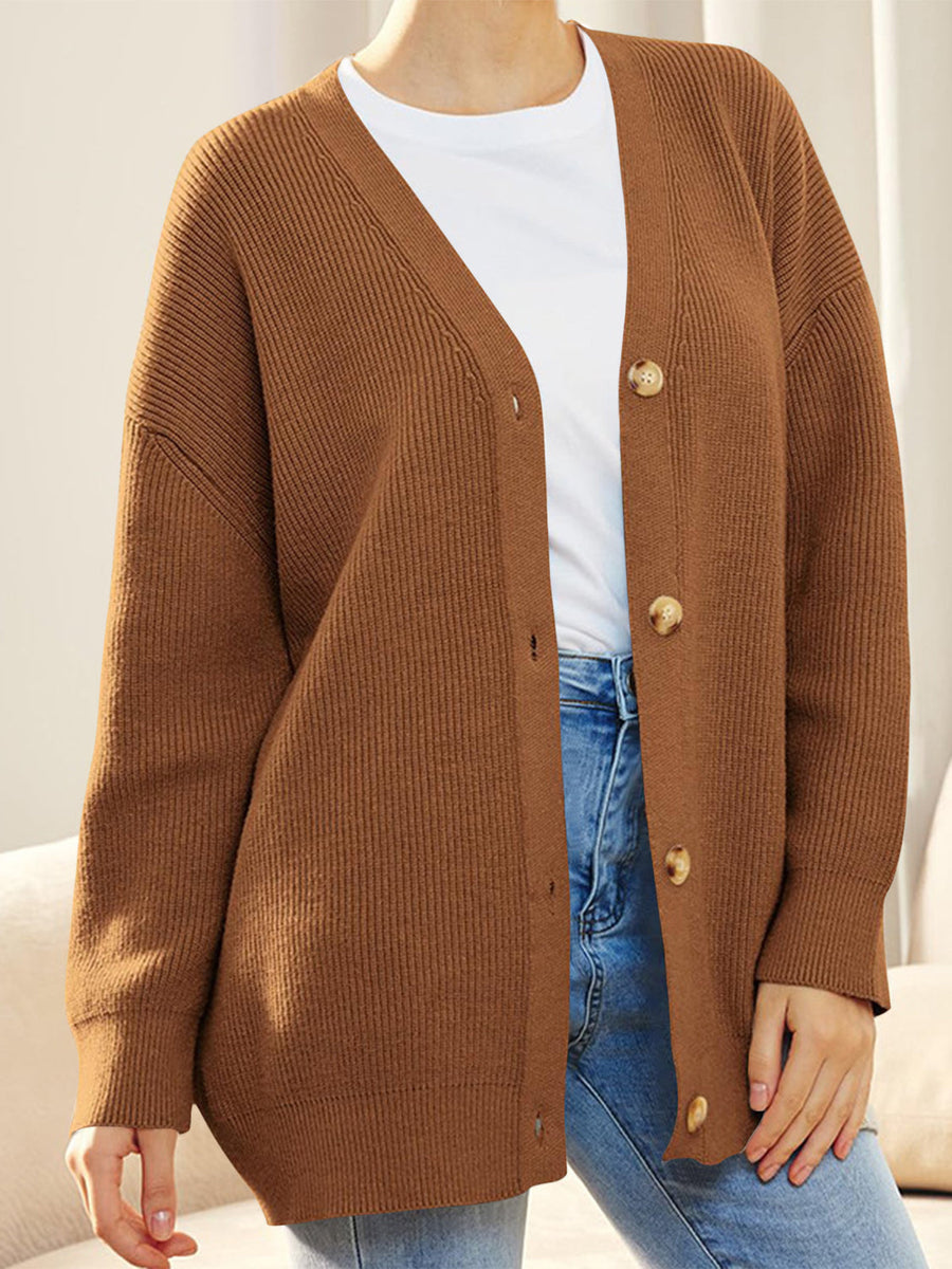 Ochre ribbed knit cardigan with balloon sleeves and button front.