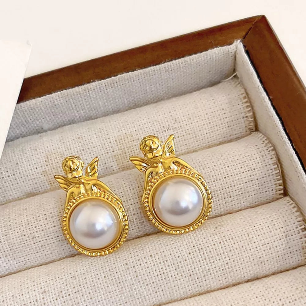 earrings in gold featuring angel motif and regular fit