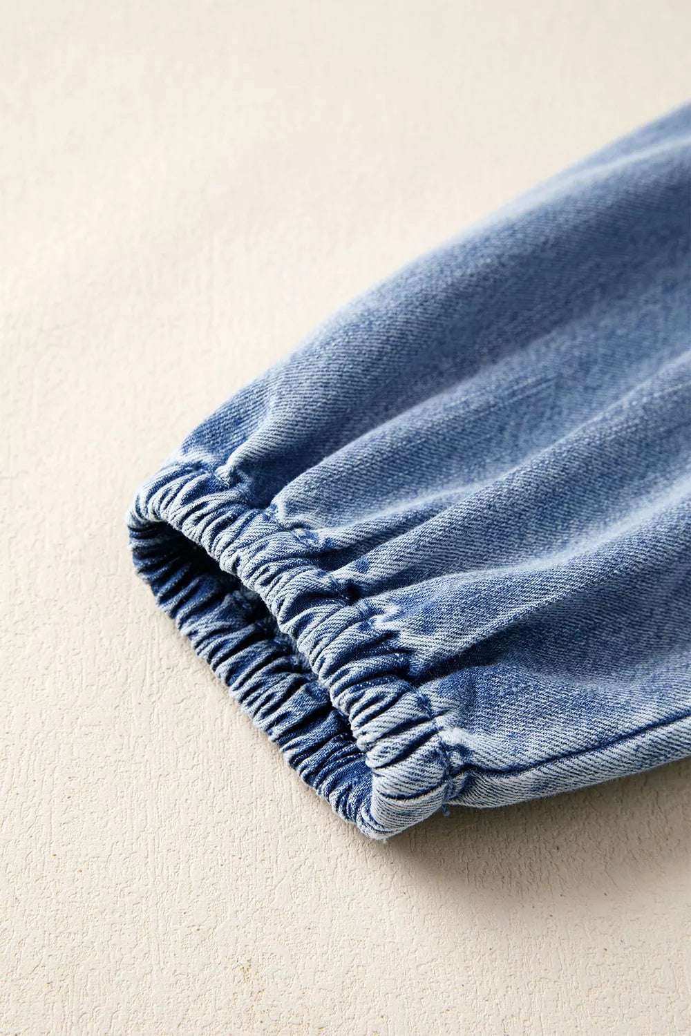Puff Sleeve V Neck Ruffled Denim Mini Dress in medium wash denim blue with tied