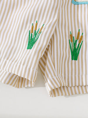 Baby shorts with tan and white stripes and embroidered cattails.
