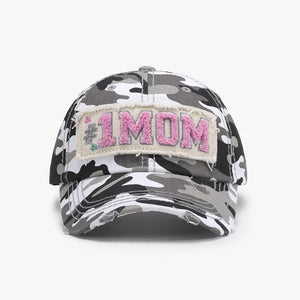 Camouflage baseball cap with "#1 MOM" patch and distressed brim.