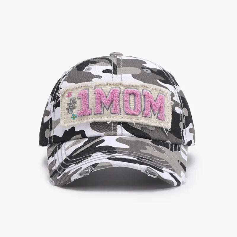 Camouflage baseball cap with "#1 MOM" patch and distressed brim.