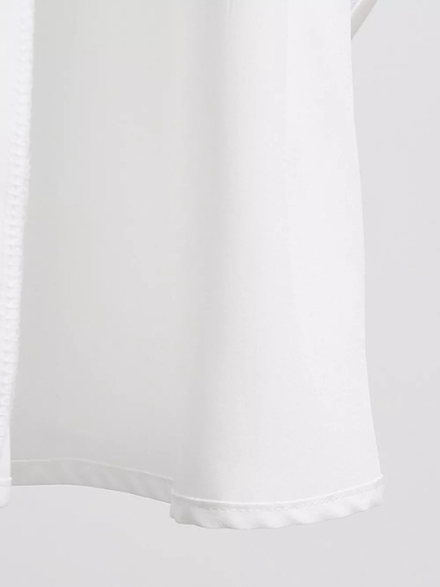 White linen blend dress with textured trim and scalloped hem