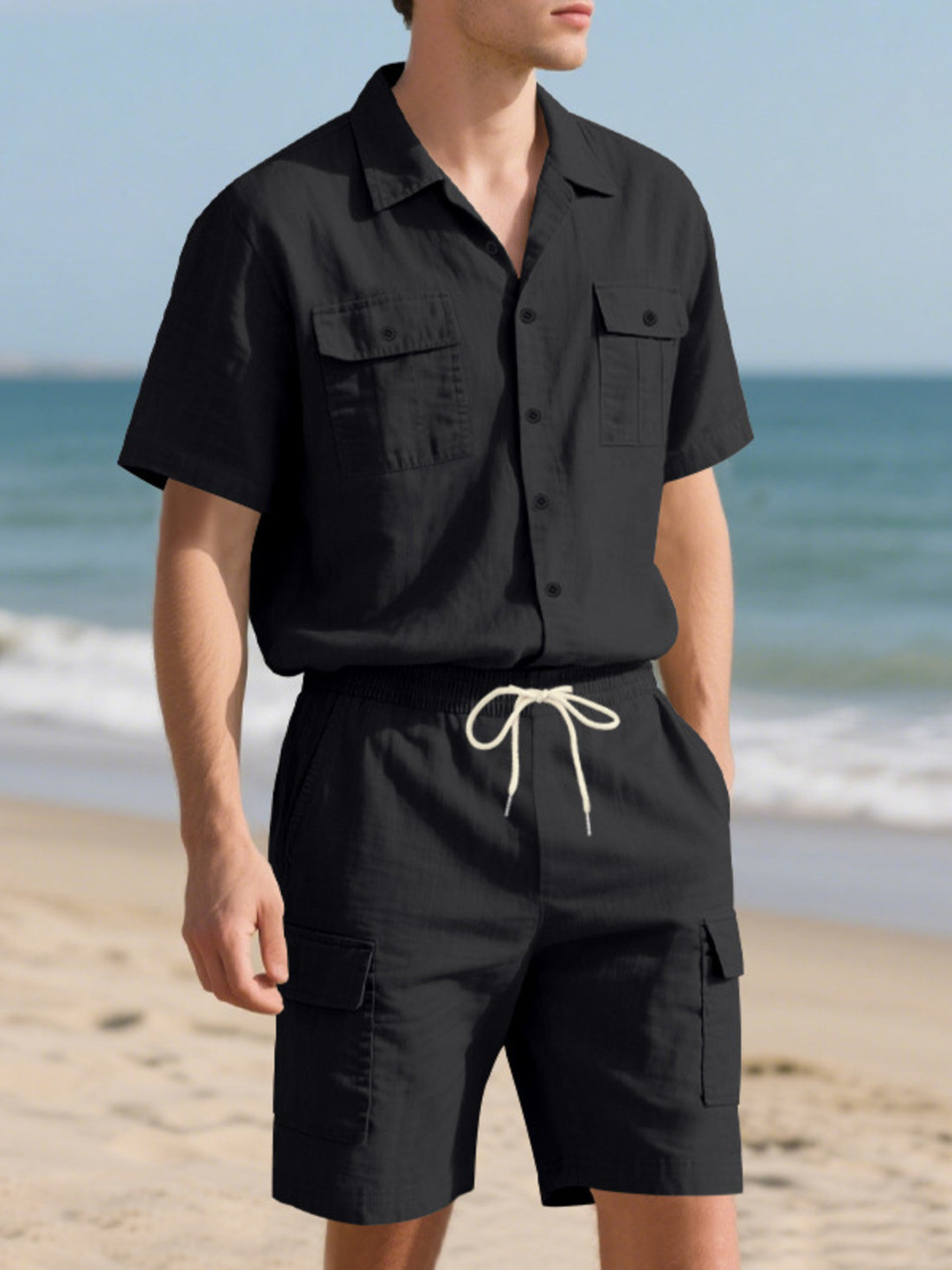 Black relaxed-fit button-up shirt and drawstring shorts set with dual chest pockets.