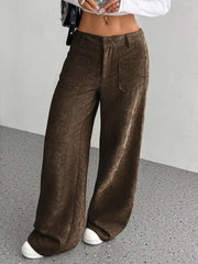 Brown corduroy wide-leg trousers with front pockets and a comfortable fit.
