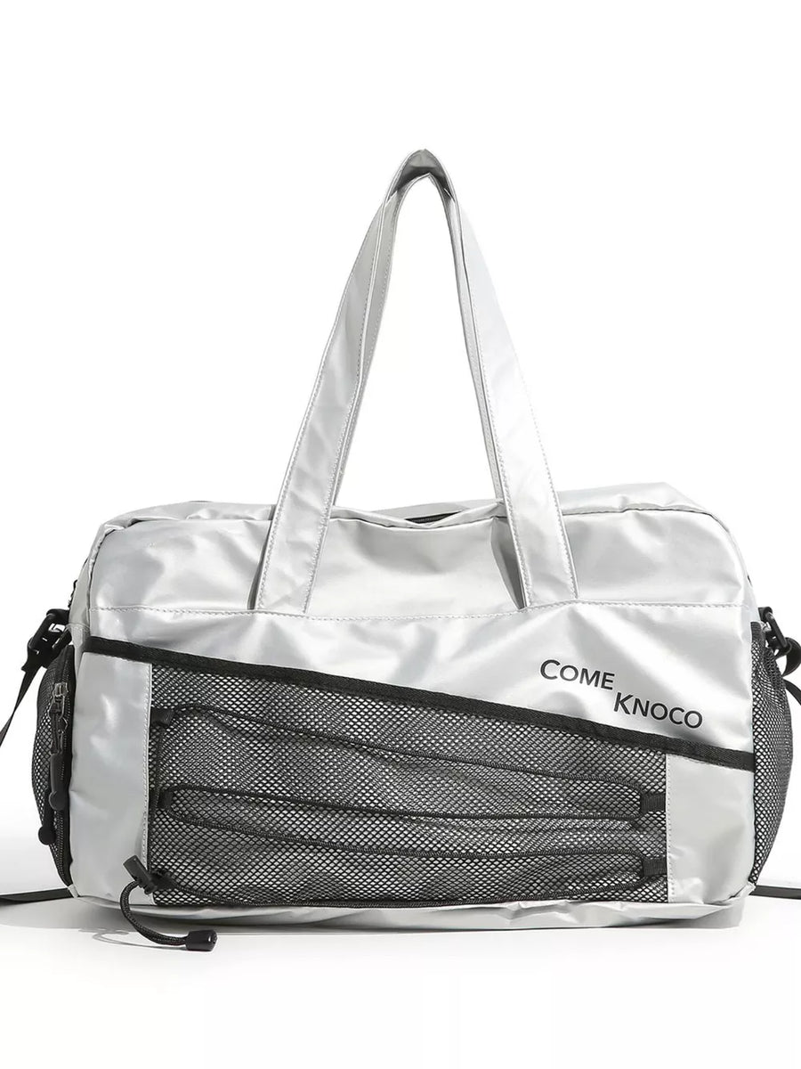 Sleek silver duffel bag with mesh pockets and adjustable strap.