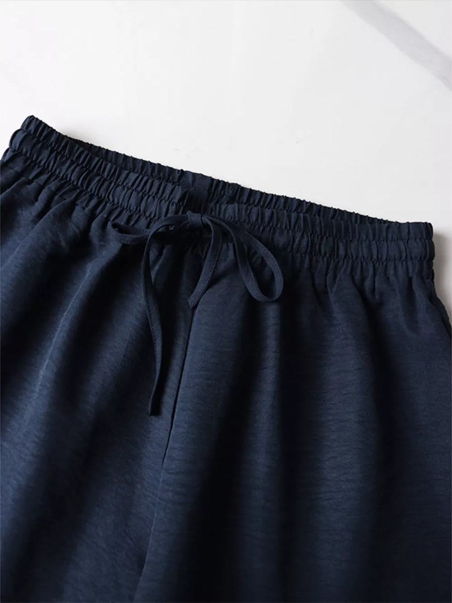 Navy blue drawstring shorts with elastic waistband