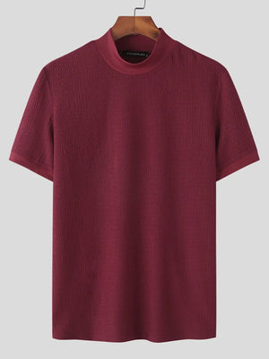 Burgundy textured knit mock neck tee with short sleeves.