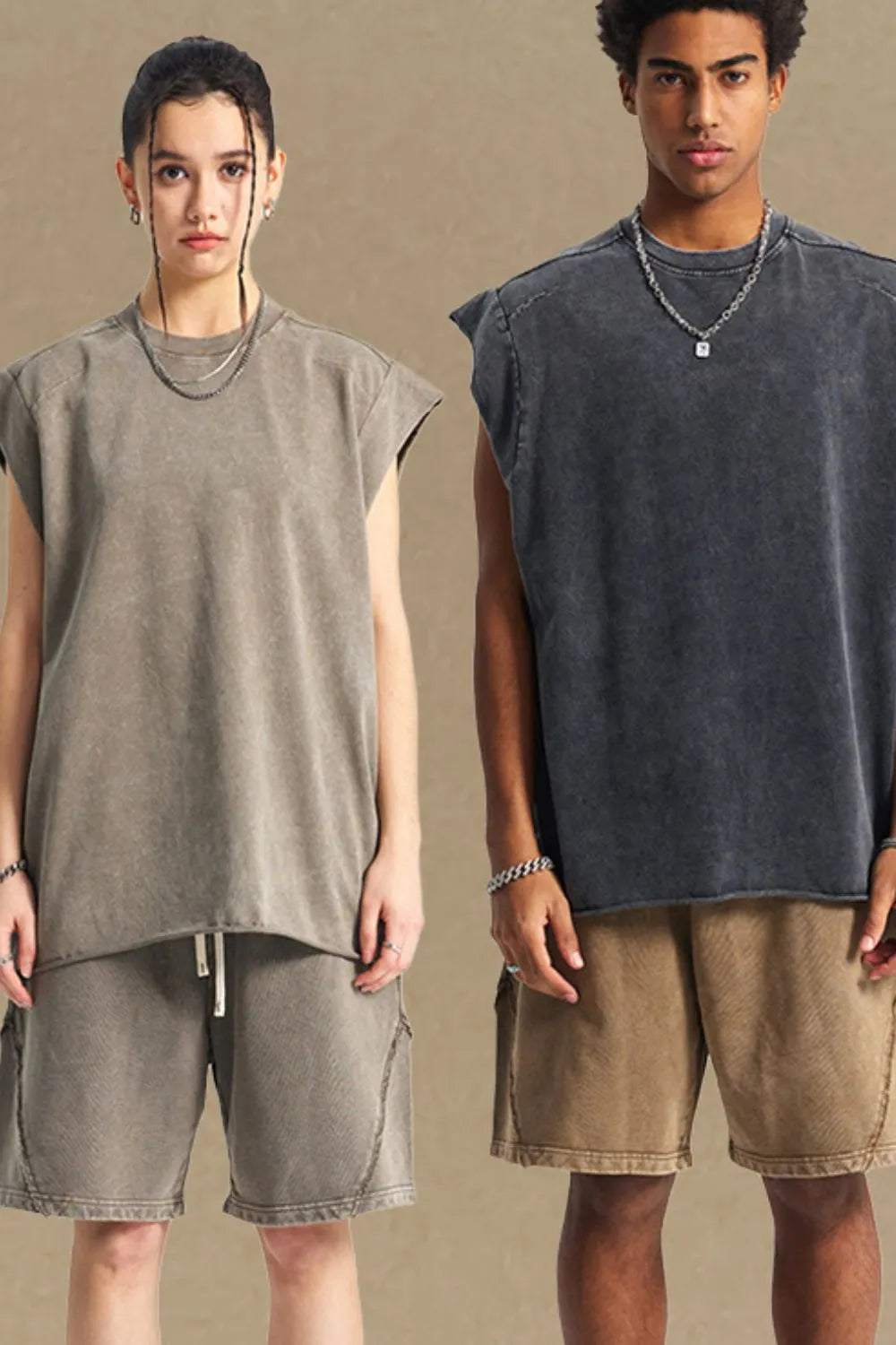 Raw edge muscle tank top in taupe and dark gray with raw hem and dropped shoulders.
