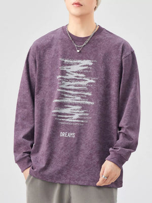 Purple oversized long-sleeve graphic tee with distressed text print and "DREAMS" graphic.