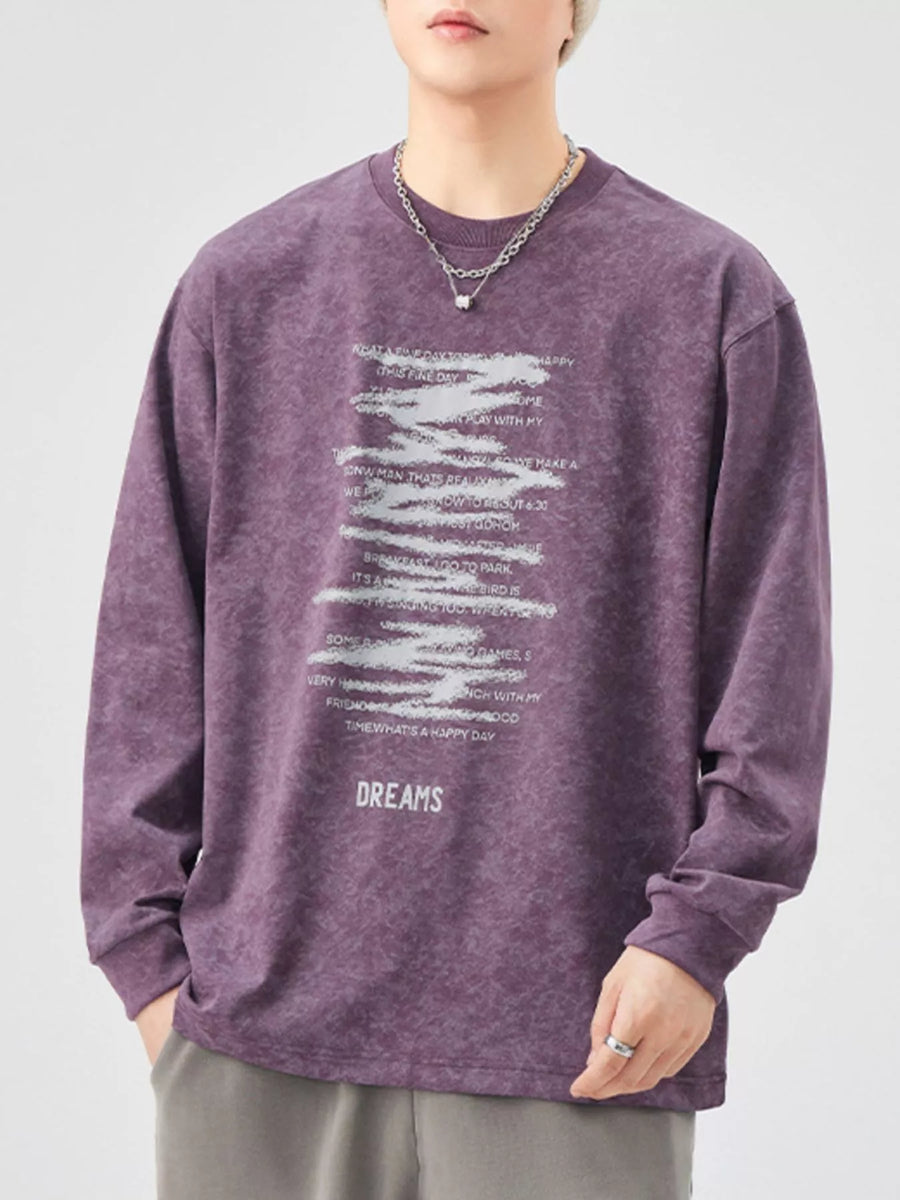 Purple oversized long-sleeve graphic tee with distressed text print and "DREAMS" graphic.