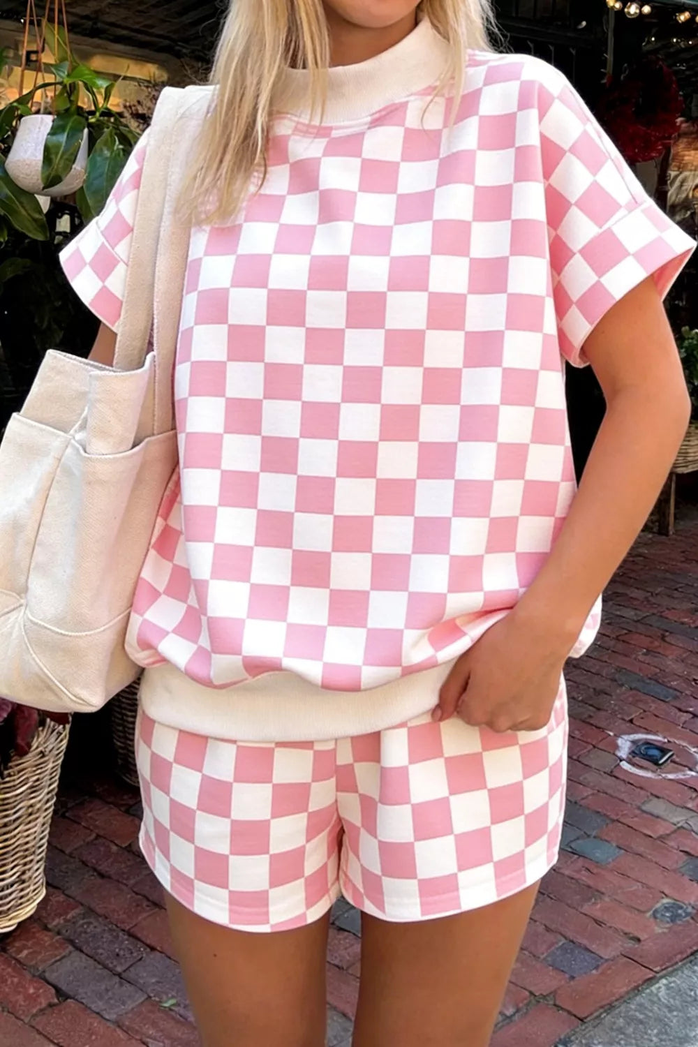 Chic checkerboard pink and white bikini shorts and top set.