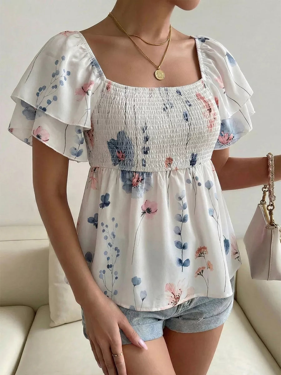 Smocked square neck blouse with flutter sleeves and a floral print.