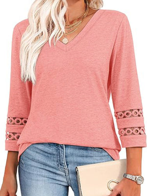 Pink V-neck t-shirt with 3/4 sleeves featuring cutout detail at cuffs.