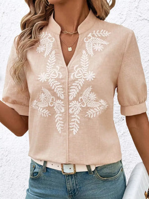 Apricot embroidered notched blouse with cuffed sleeves and V-neck.