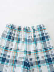 Boys' cotton plaid shorts with drawstring waist and elastic waistband.