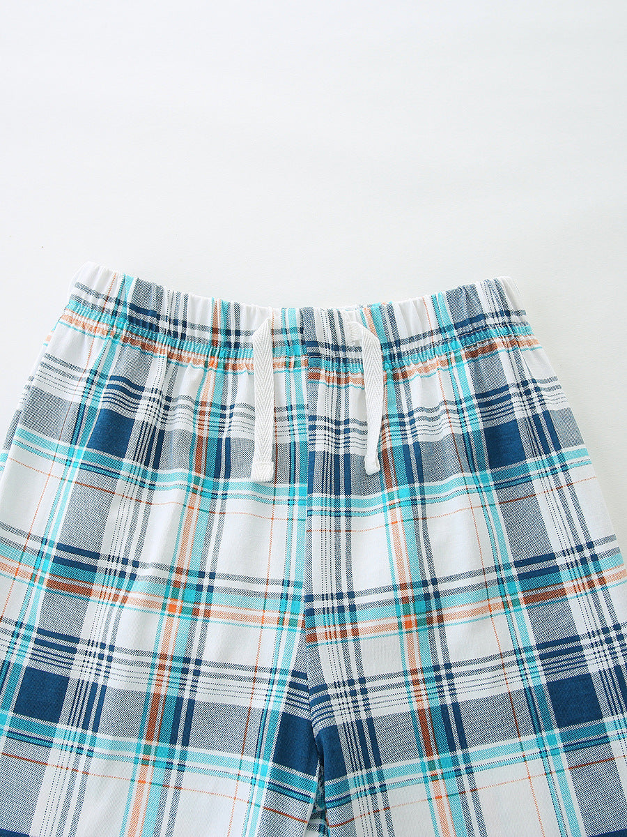 Boys' cotton plaid shorts with drawstring waist and elastic waistband.