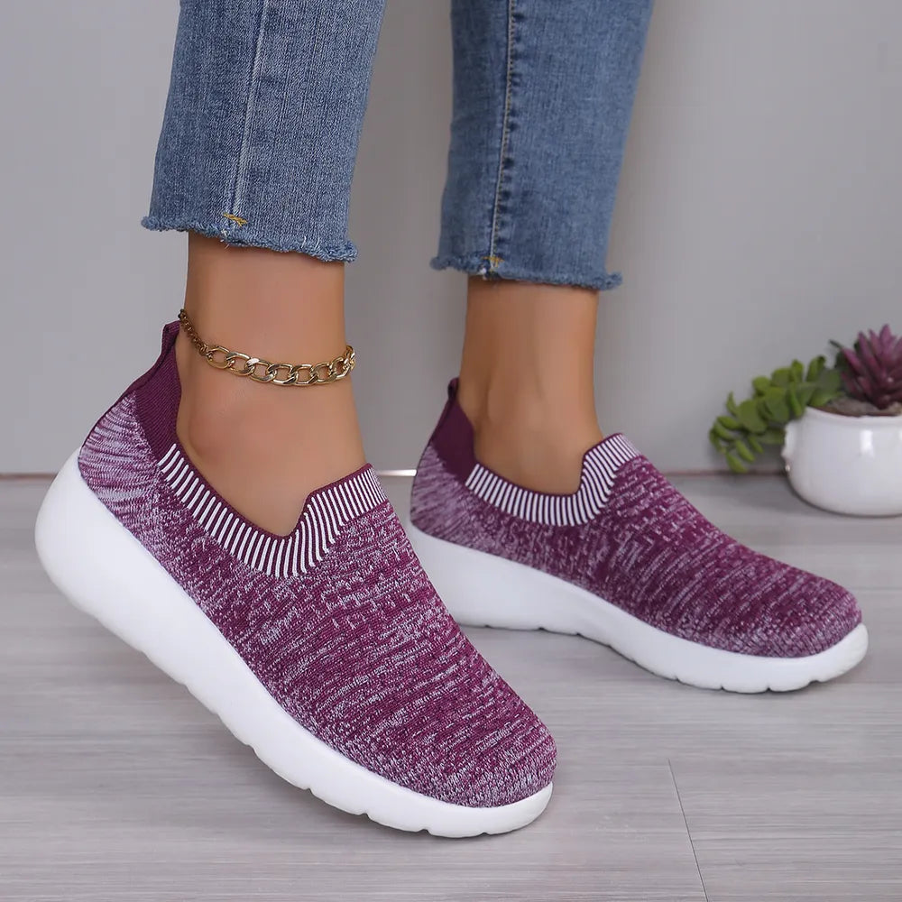 Knit slip-on sneakers in mauve with white striped trim and a sculpted white sole.