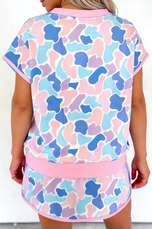 Pastel camouflage athletic two-piece set with pink trim.