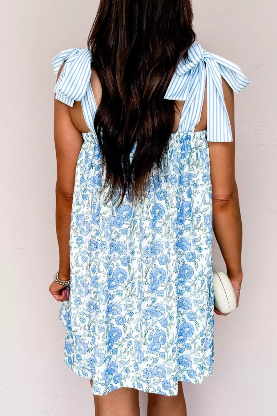 Botanical print mini dress with blue stripes and tie straps, polyester.