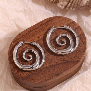 gold with earrings with spiral design