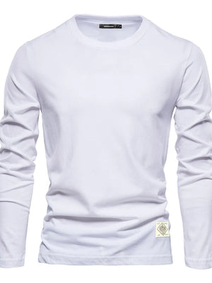 White long sleeve crew-neck tee with textured fabric and a decorative patch detail.