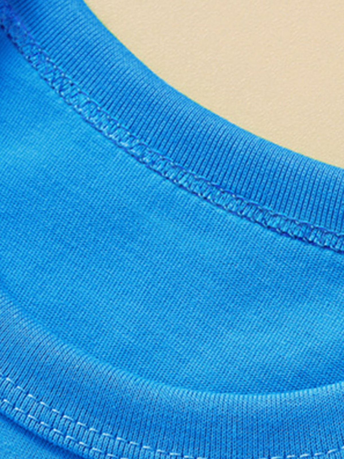 Toddler blue t-shirt with ribbed crew neck and double-stitched seams.