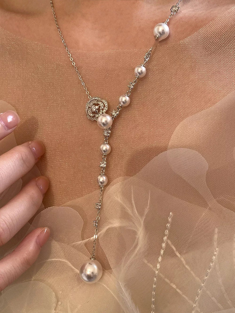 White pearl flower Y-necklace with clear crystal accents and a large pearl drop.