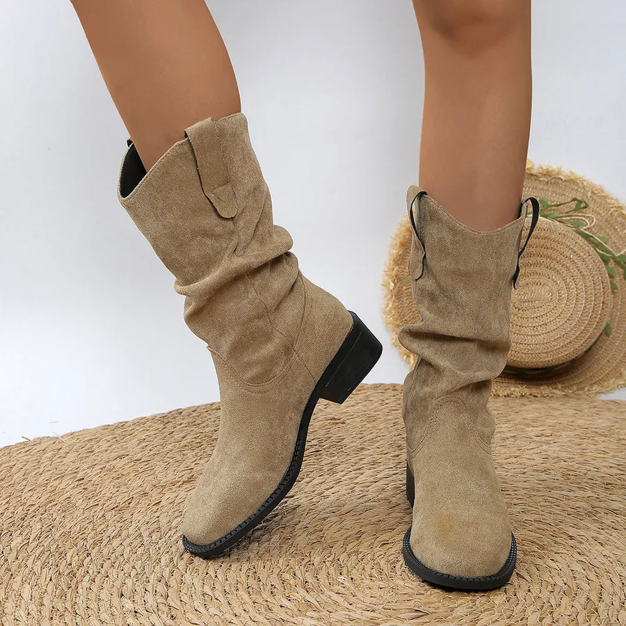 Slouchy khaki ankle boots with a Western-inspired design and block heel.