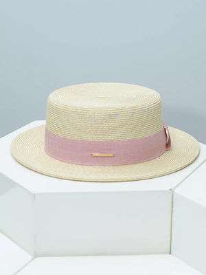Straw boater hat in beige with a blush pink ribbon band and gold detail