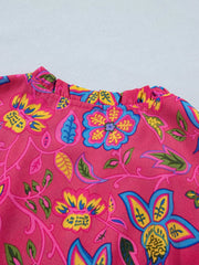 Floral midi dress with ruffled neckline and sleeves in a cerise cotton blend.