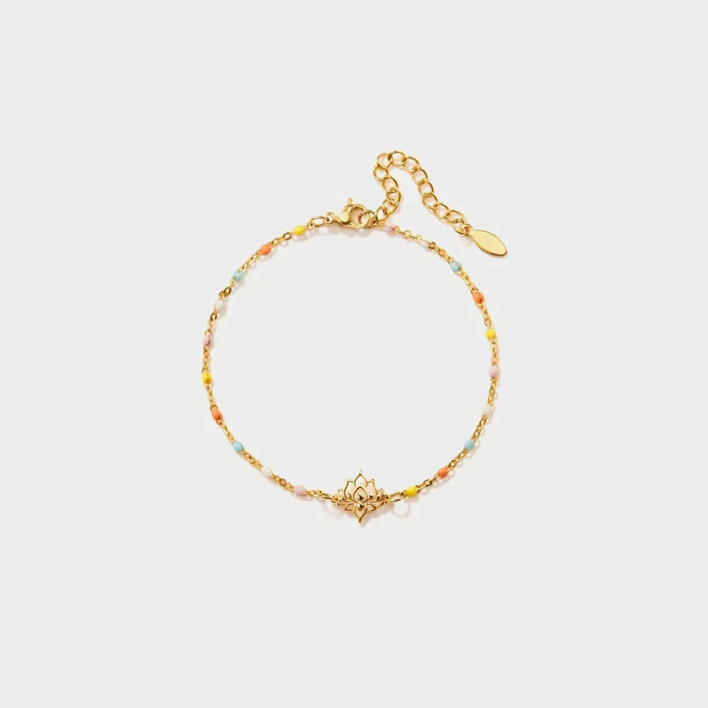 Gold enamel bead bracelet with lotus charm and adjustable clasp