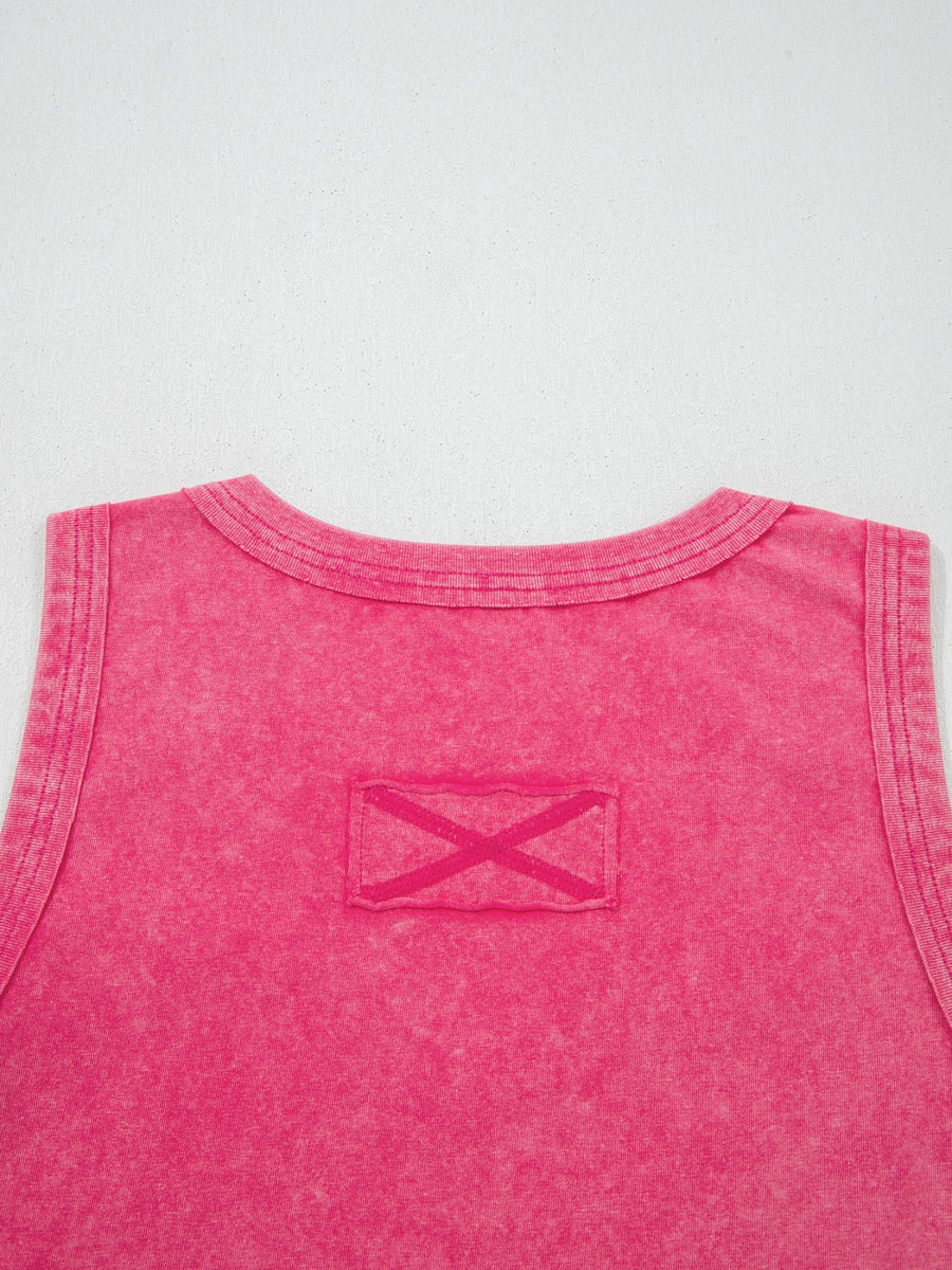 Textured cotton tank top in pink with a V-neck and a decorative X detail on a patch.
