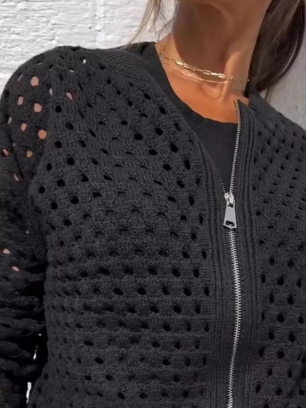 White cardigan featuring zipper and openwork