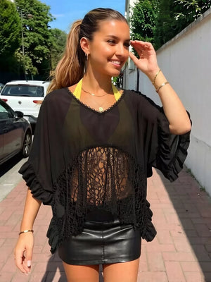 Black lace-trimmed sheer flowing cover-up with ruffled sleeves and V-neck.