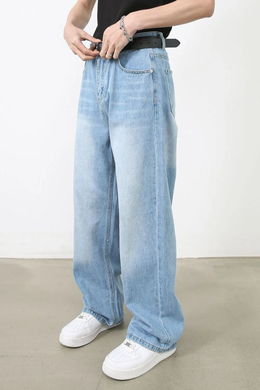 Light blue faded denim baggy jeans with a casual fit.