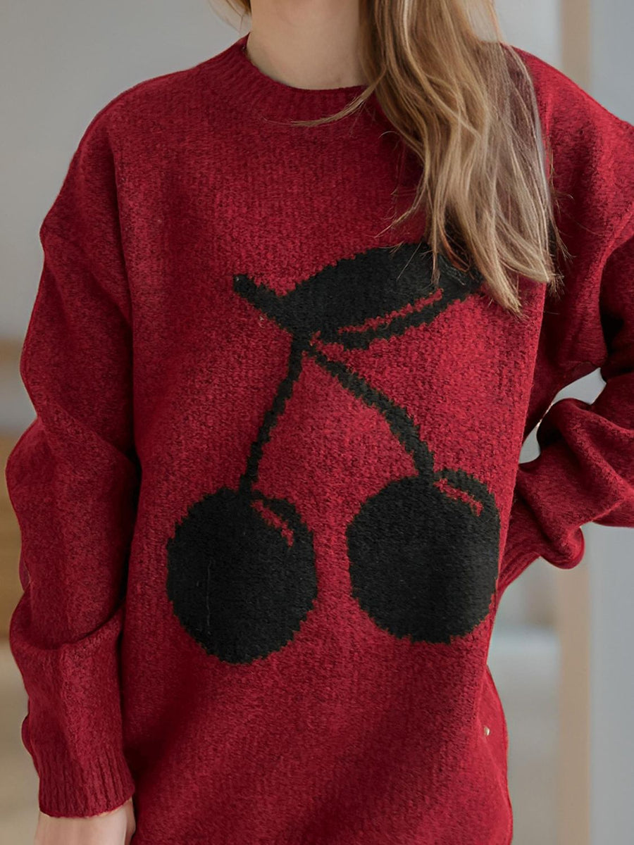 Burgundy knit sweater with black cherry motif, crew neck, long sleeves.