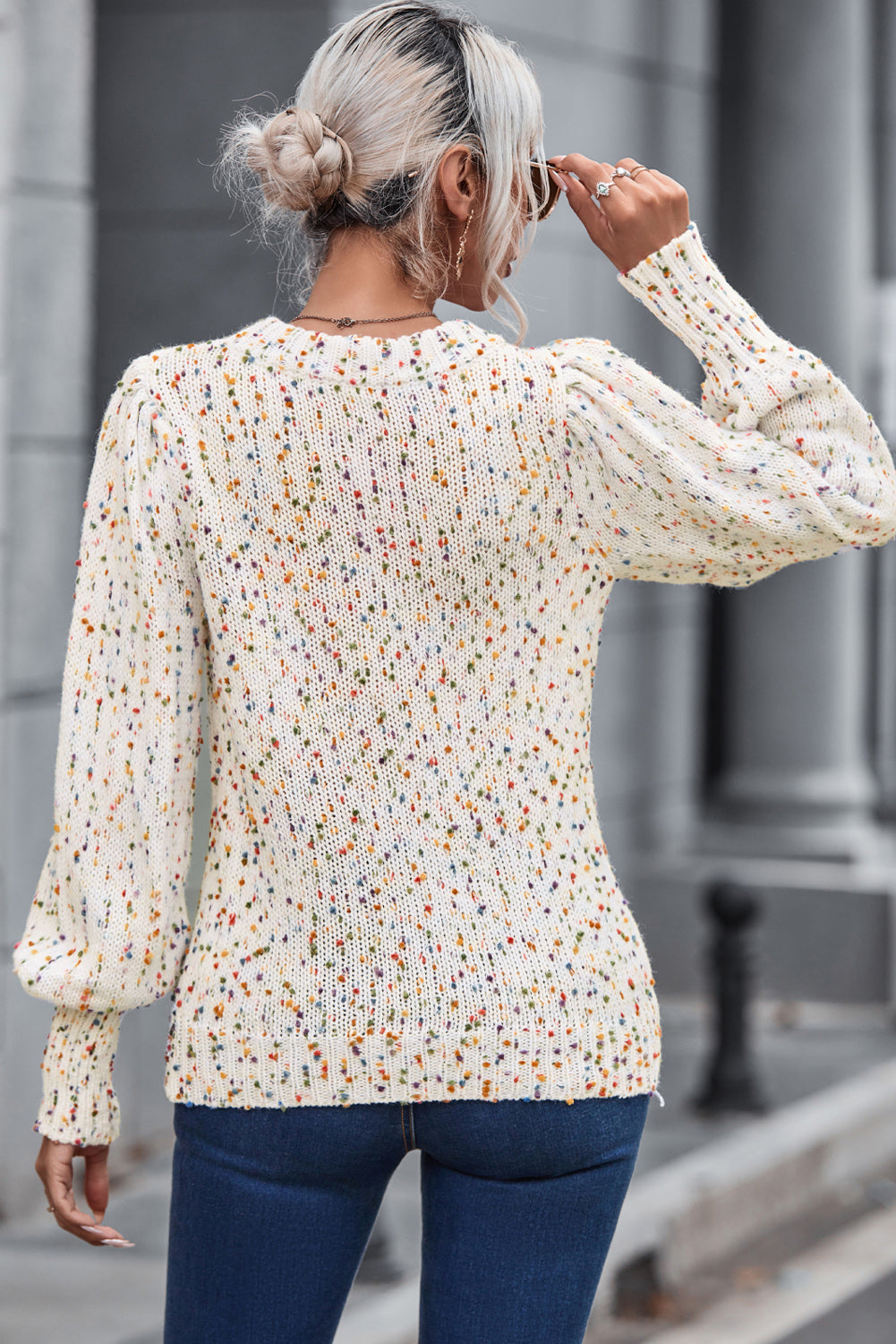 Cream confetti speckle knit sweater with puff sleeves and a crew neck.