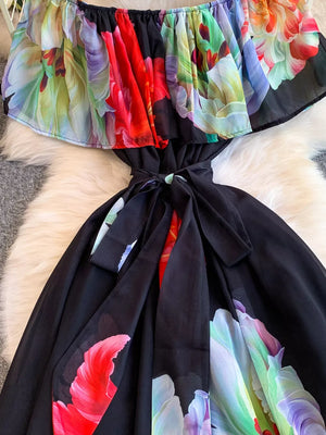 Botanical print off-shoulder A-line dress with ruffled neckline and belted waist.