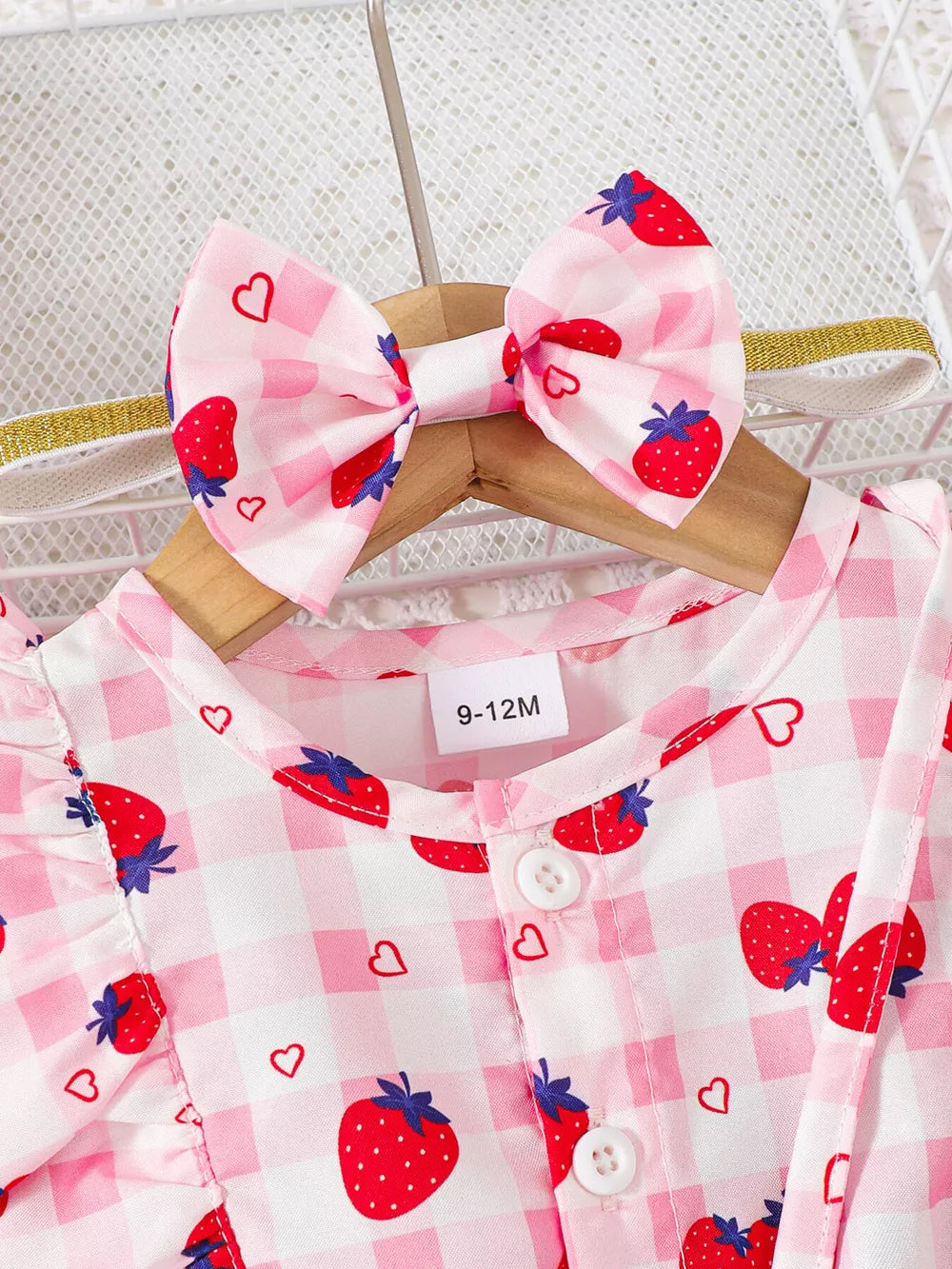 Strawberry ruffle jumpsuit with headband set, pink gingham pattern, button-down front, and ruffled sleeves.