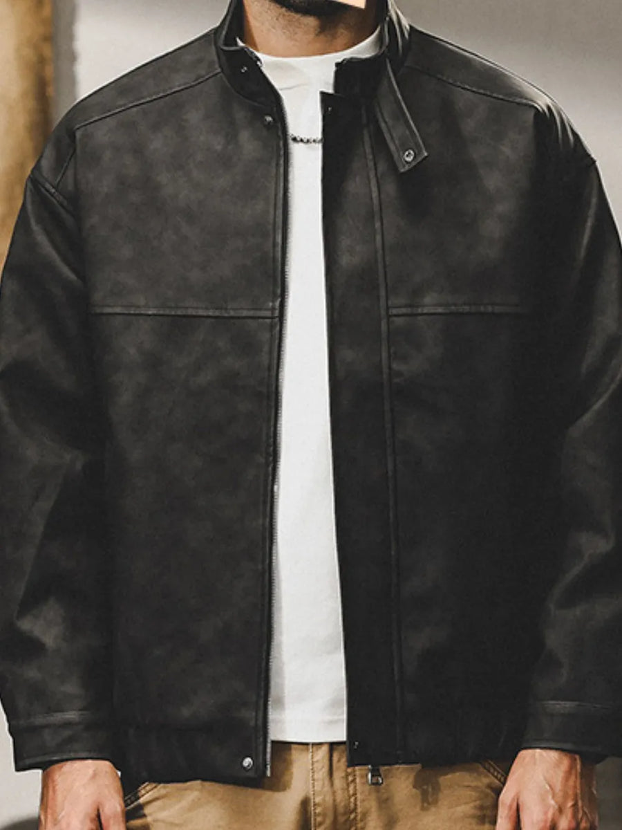 Black distressed leather bomber jacket with stand collar and zipper closure